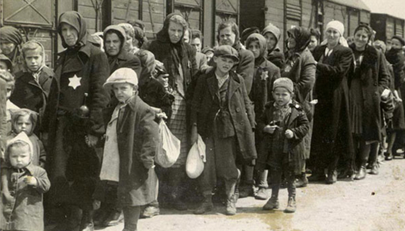 Jewish women and children arrive at Auschwitz-Birkenau from Hungary in cattle cars