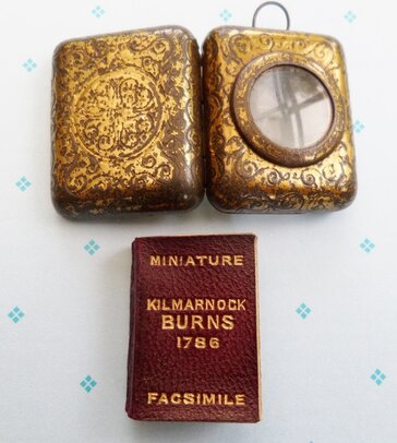miniature Kilmarnock Burns issued in protective case with magnifying glass for troops World War I