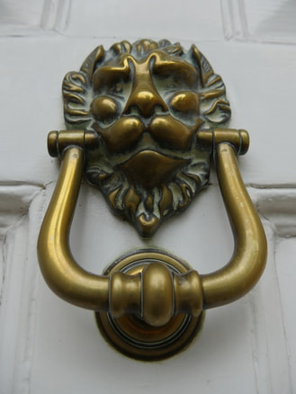 lion’s head door knockers were intended to serve the same symbolic function as the lion statues which decorated the gates of the Mycenaean citadel